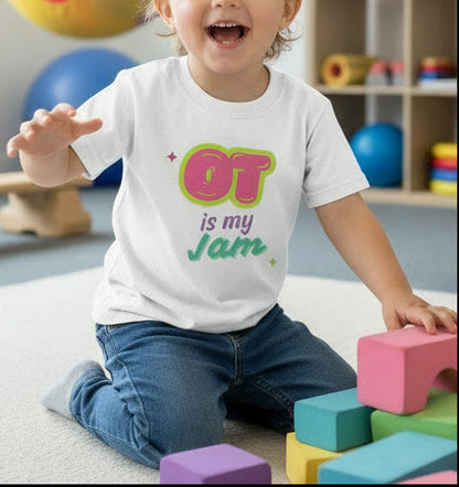 White t-shirt with 'OT is my Jam' text in colorful letters on a white clinic background, kid playing in occupational therapy
