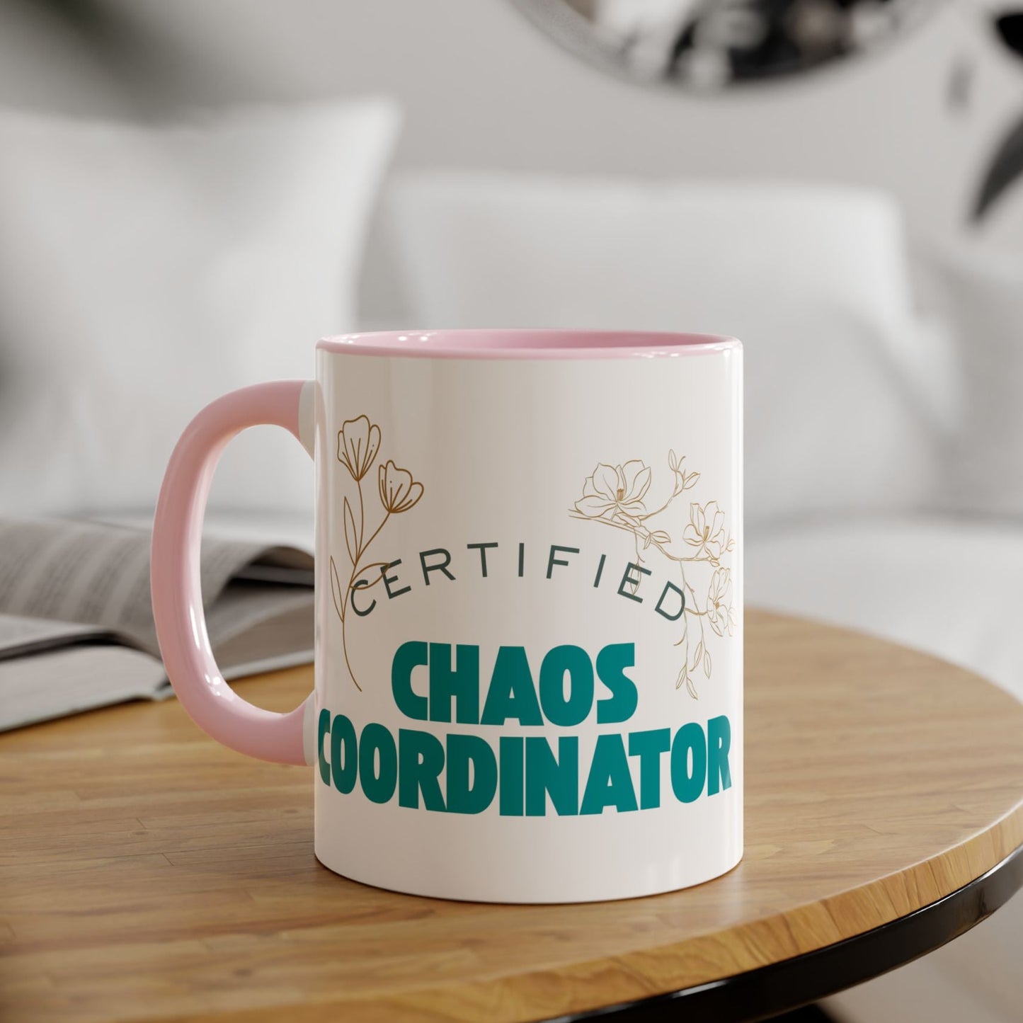 Mug with 'Certified Chaos Coordinator' text on a wooden table