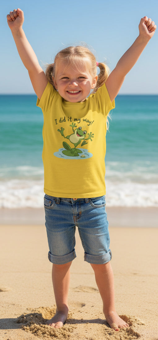 Yellow t-shirt with a frog graphic that says "I did it my way" and text on a beach background