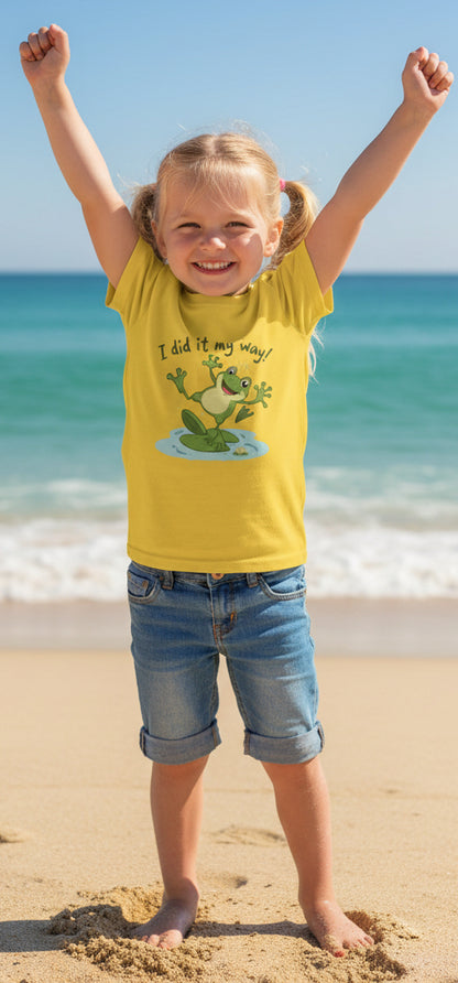Yellow t-shirt with a frog graphic that says "I did it my way" and text on a beach background